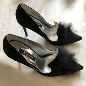Spike heels with feathers.